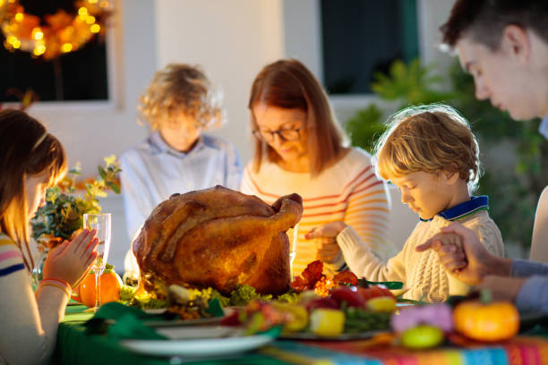 istock Thanksgiving family dinner. Roasted turkey meal. 1728001650