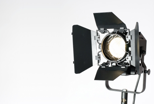 Lighting equipment in action. Isolated on white.See moreaA|