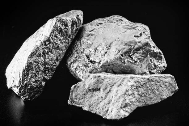 istock silver nugget native to Liberia isolated on black background. 1728008734