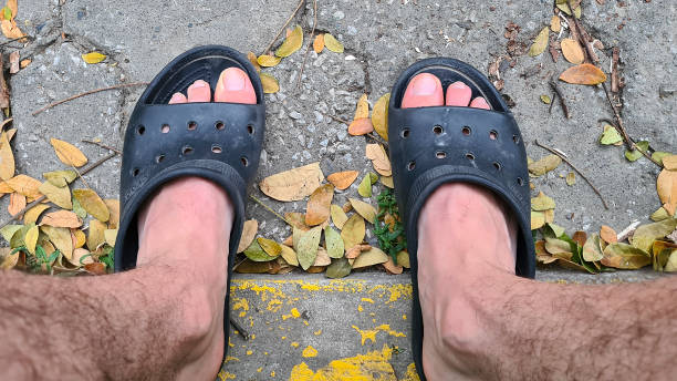istock Man legs with sandals top view shot 1728011001