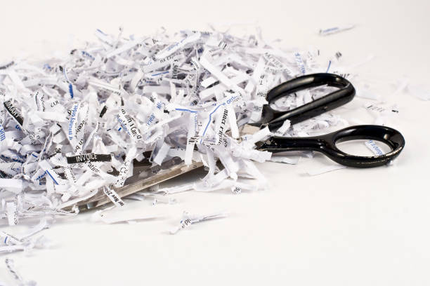 Shredded paper, scissors stock photo