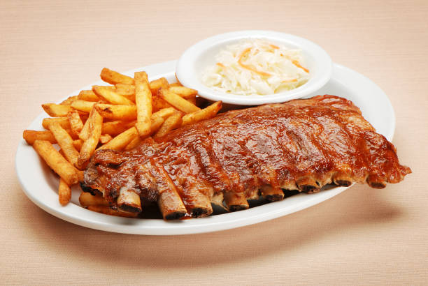 grilled pork ribs and potatoes isolated on white background