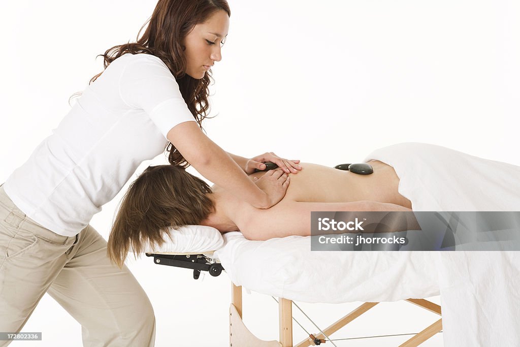 Massage aux pierres chaudes - Photo de Adulte libre de droits