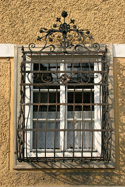 istock barred window of an old house 172802386