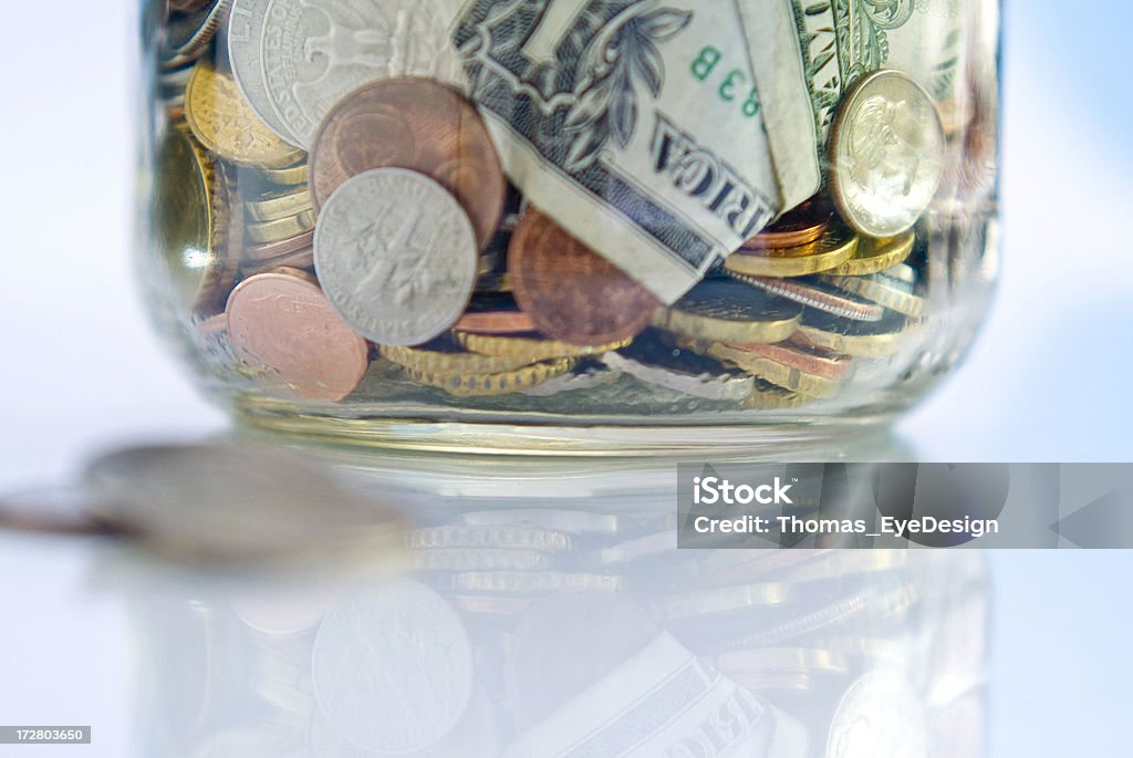 MoneyTip Jar Series Saving money by placing coins in a Jar, part of a series. Tip Jar Stock Photo