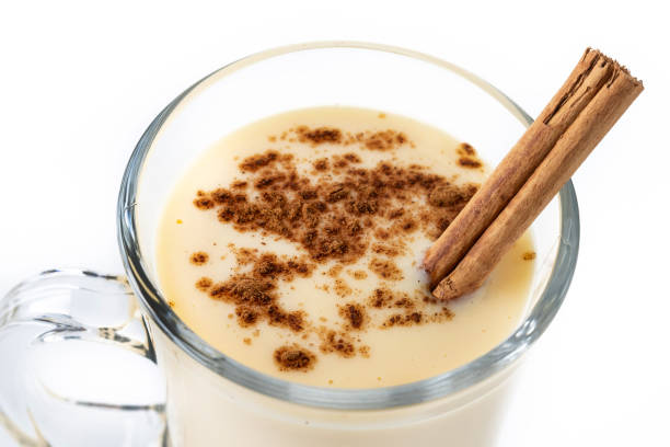 istock Homemade eggnog with cinnamon on wooden table. Typical Christmas dessert 1728042087