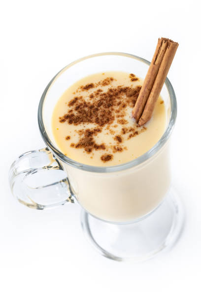 istock Homemade eggnog with cinnamon on wooden table. Typical Christmas dessert 1728042093