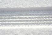 Tire track in fresh powdery snow