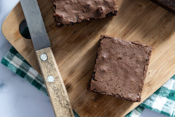 istock Chocolate brownie portions on marble background 1728045542