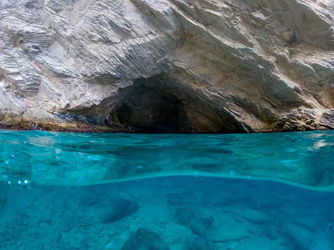 Mavi Magara - blue cave near Oludeniz, split underwater image.