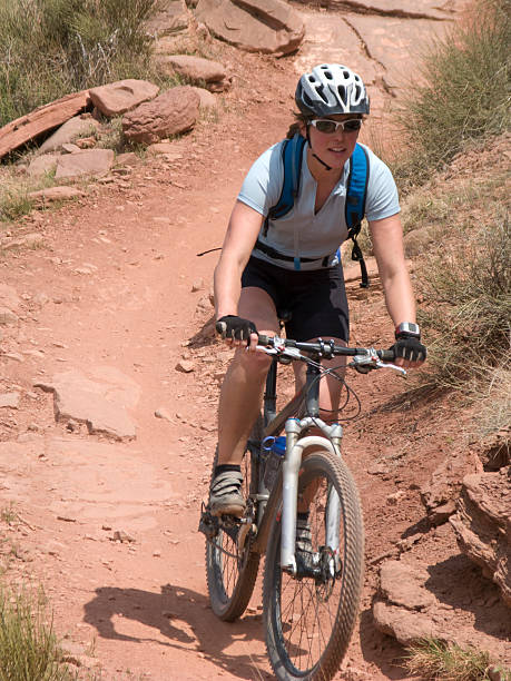 istock Female in her 20's on a mountain bike. 172805036