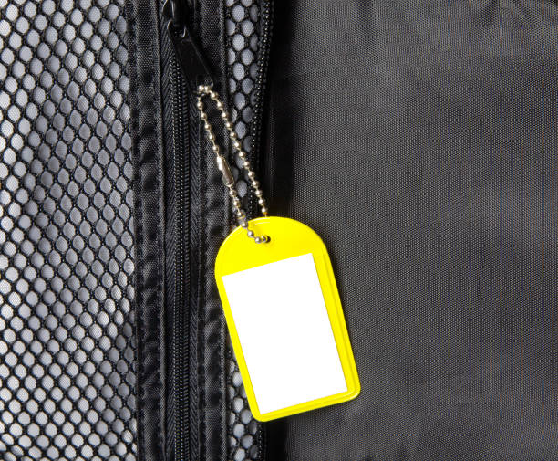 istock Blank yellow plastic label on chain insinde nylon luggage 172805330