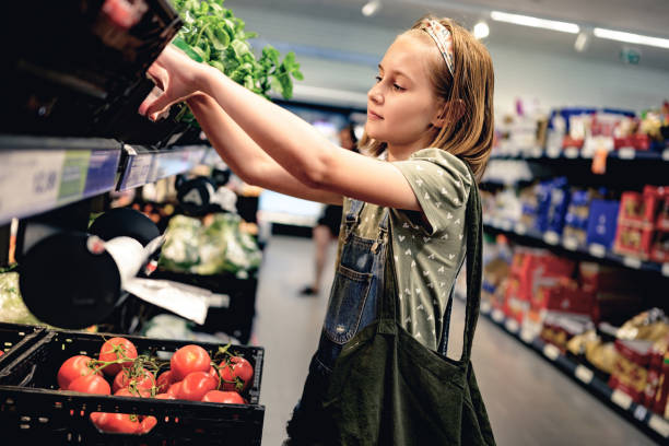 Pretty girl child shopping in supermarket