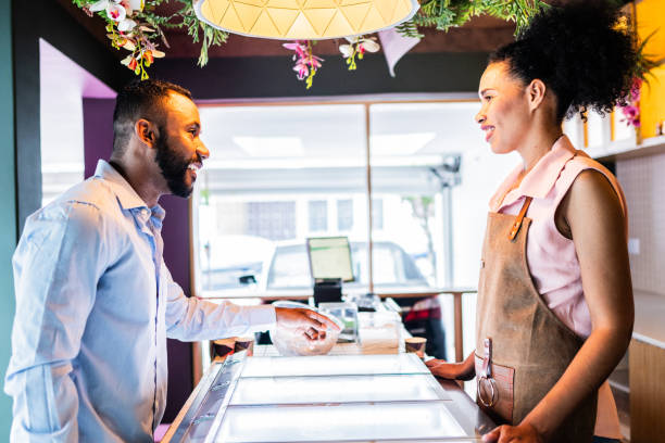 istock Customer choosing ice cream at ice cream shop 1728059044