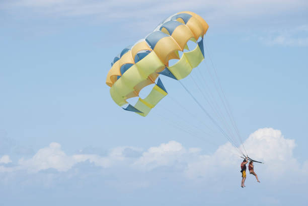 istock Two People Parasail in Summery Blue Sky 172806322