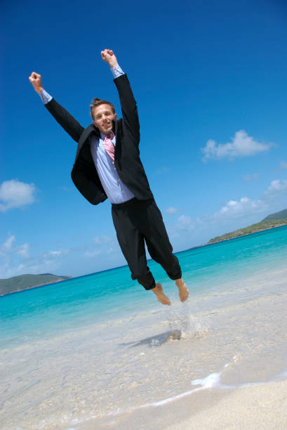 istock Excited Businessman Flying Like Superhero on Tropical Beach 172806723