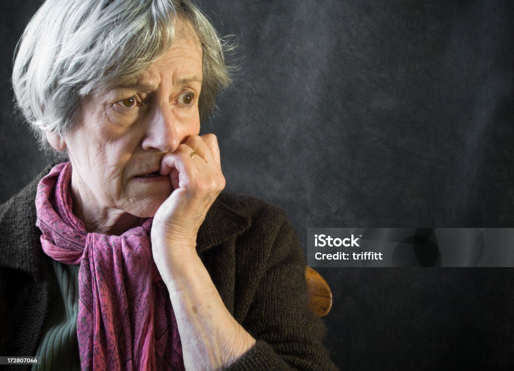 Seriously worried woman. "Worried,even distraught, elderly woman. Copy space" Senior Adult Stock Photo