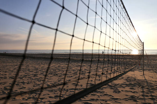 istock beach volleyball sand court at sunset 1728074848