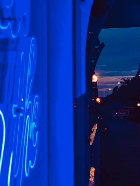 istock Blue neon lights on Llandudno Pier in Wales 1728075075