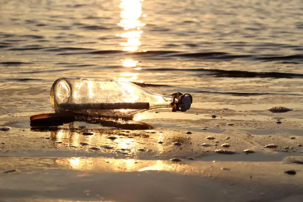 message in a bottle stranded on the beach