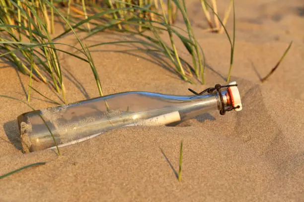 message in a bottle stranded on the beach