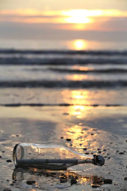 message in a bottle stranded on the beach