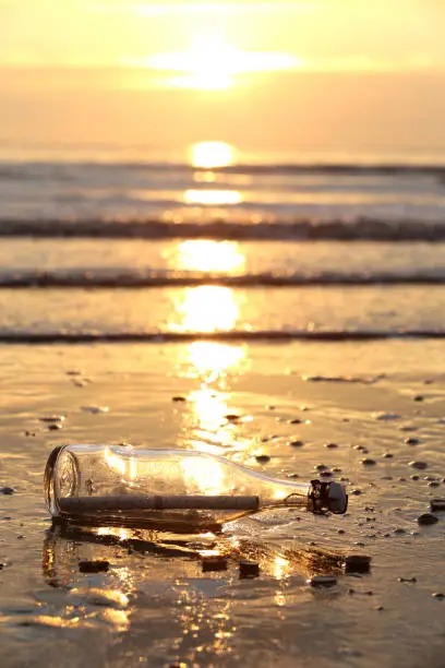 message in a bottle stranded on the beach