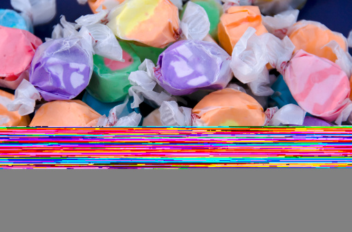 A summer treat, brightly colored wrapped salt water taffy candies. (SEE LIGHTBOXES BELOW for more in this series, as well as many more candies, desserts, baked foods, and other food photos...)