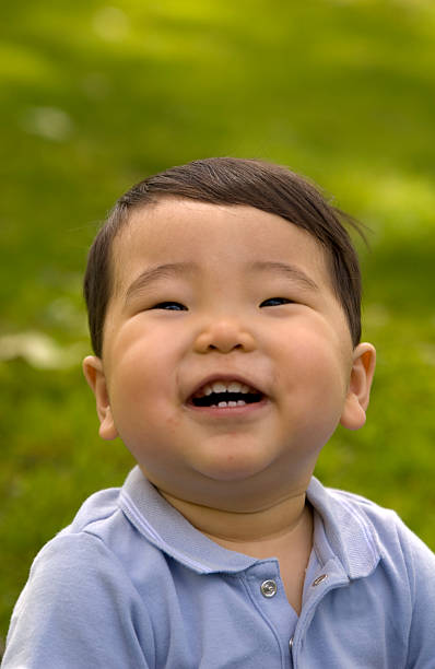 istock Asian Baby Boy, Laughing Child Outdoors in Spring 172808347