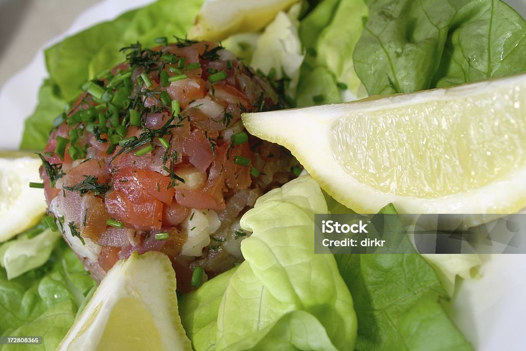 Fish Tatar Fish Tatar, made of smoked salmon, tuna and butterfish, mixed with olive oil and dill, topped with dill and leeks. Steak Tartare Stock Photo