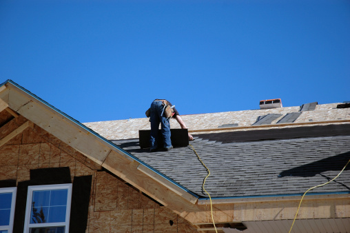 a roofer installing a new roof