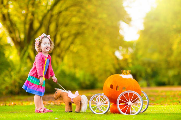 istock Little girl playing princess at pumpkin patch. 1728086770