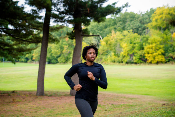 istock Young black woman running 1728088418