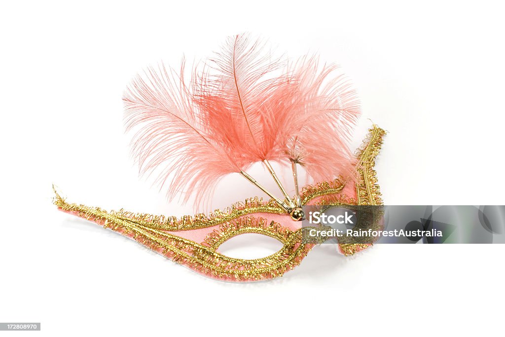 mask mask orange and gold with feathers. Celebration Stock Photo