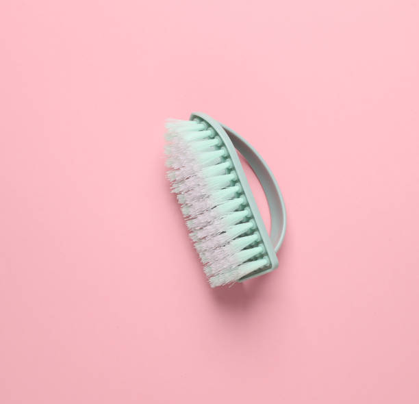 istock Blue Plastic brush for cleaning on pink background 1728092713