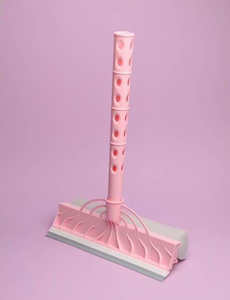 istock Window cleaning mop on pink background. 1728094374