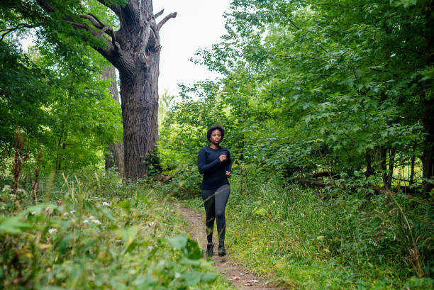 istock Young black woman running 1728095617
