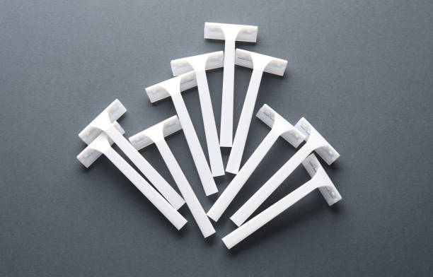 istock Disposable white plastic razors on a dark gray background 1728096209