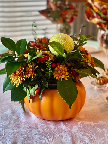 Pumpkin table decoration with flowers