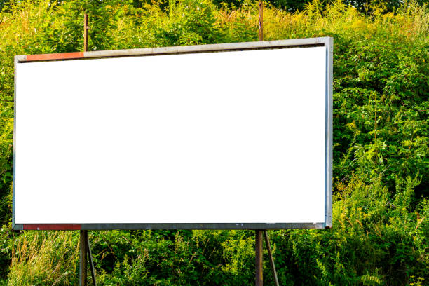 istock Blank advertisement billboard mock-up ad space rusty with green background 1728100690