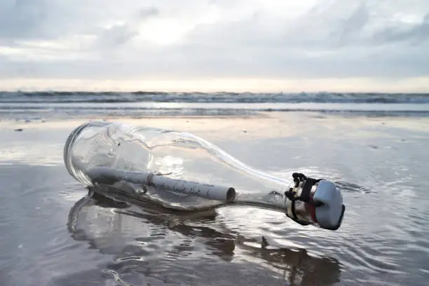 message in a bottle stranded on the beach