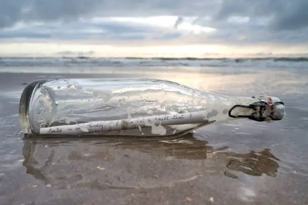 message in a bottle stranded on the beach