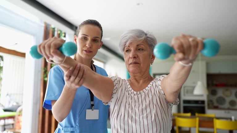 Patient at home doing physiotherapy with dumbbell