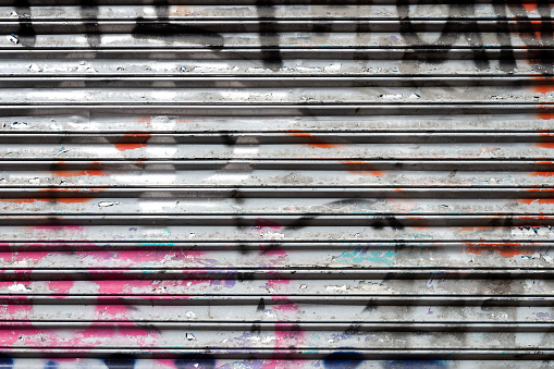 closed shutter covered with graffiti