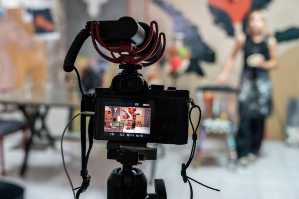 istock camera is recording for social media focus on foreground influencer is background horizontal still 1728123391