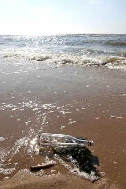 message in a bottle stranded on the beach