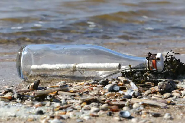 message in a bottle stranded on the beach