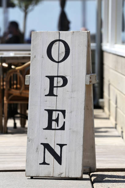 istock wooden stand-up sign 'open' 1728145598