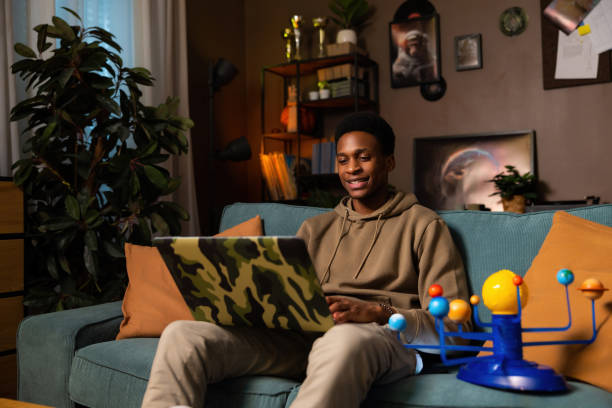 istock Delighted relieved african american dark skinned black guy in casual outfit taking a break from work or study, taking off his headphones to listen to ambient noise music taking few minutes to relax 1728162170