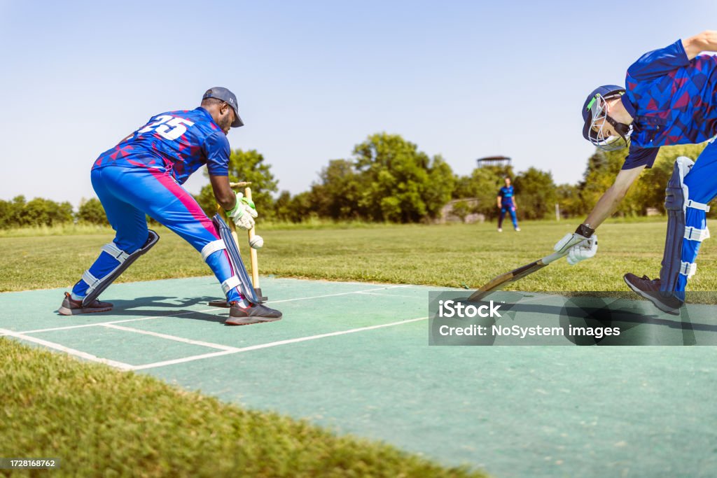 Cricket wicket keeper Cricket game. Wicket keeper preparing for stroke. Sport of Cricket Stock Photo